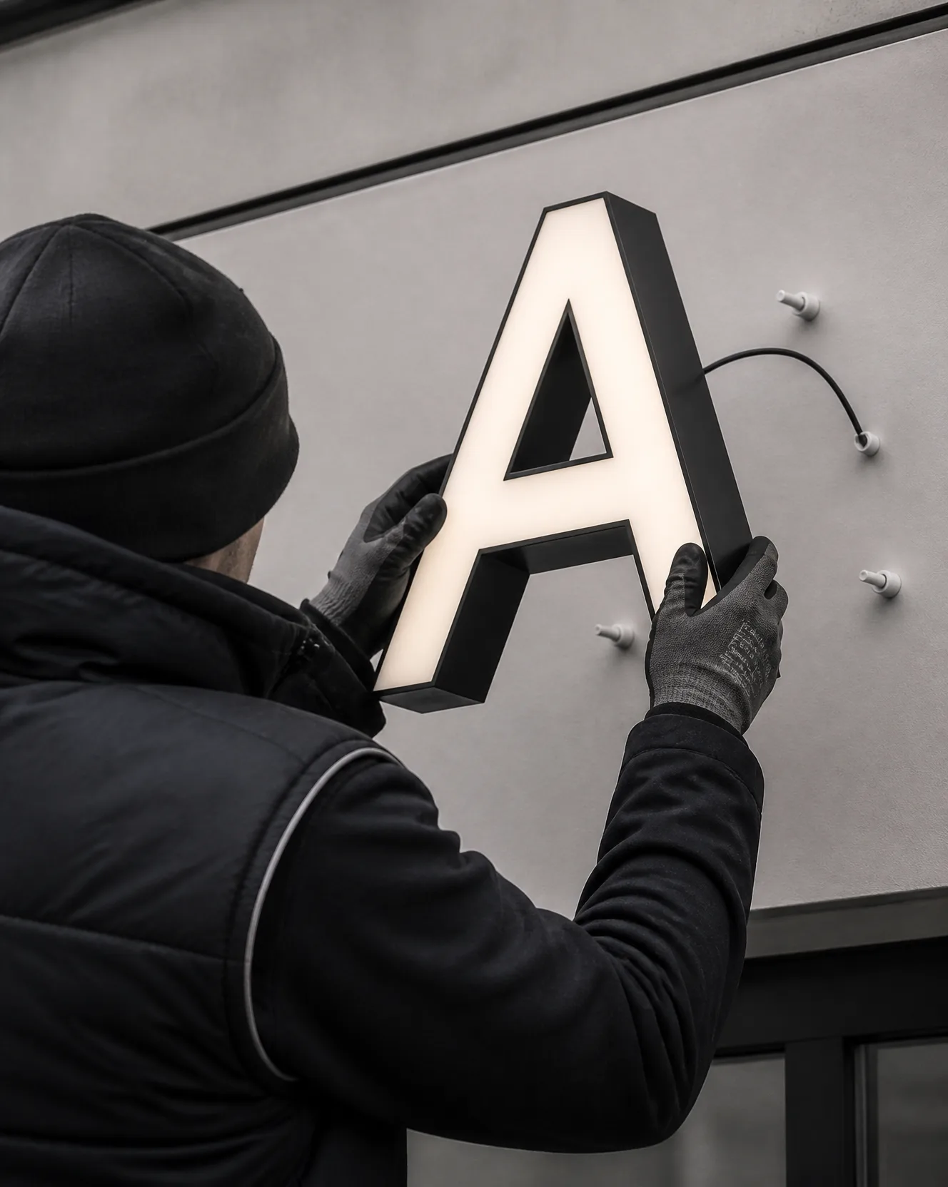 Letter being fixed to locators on site
