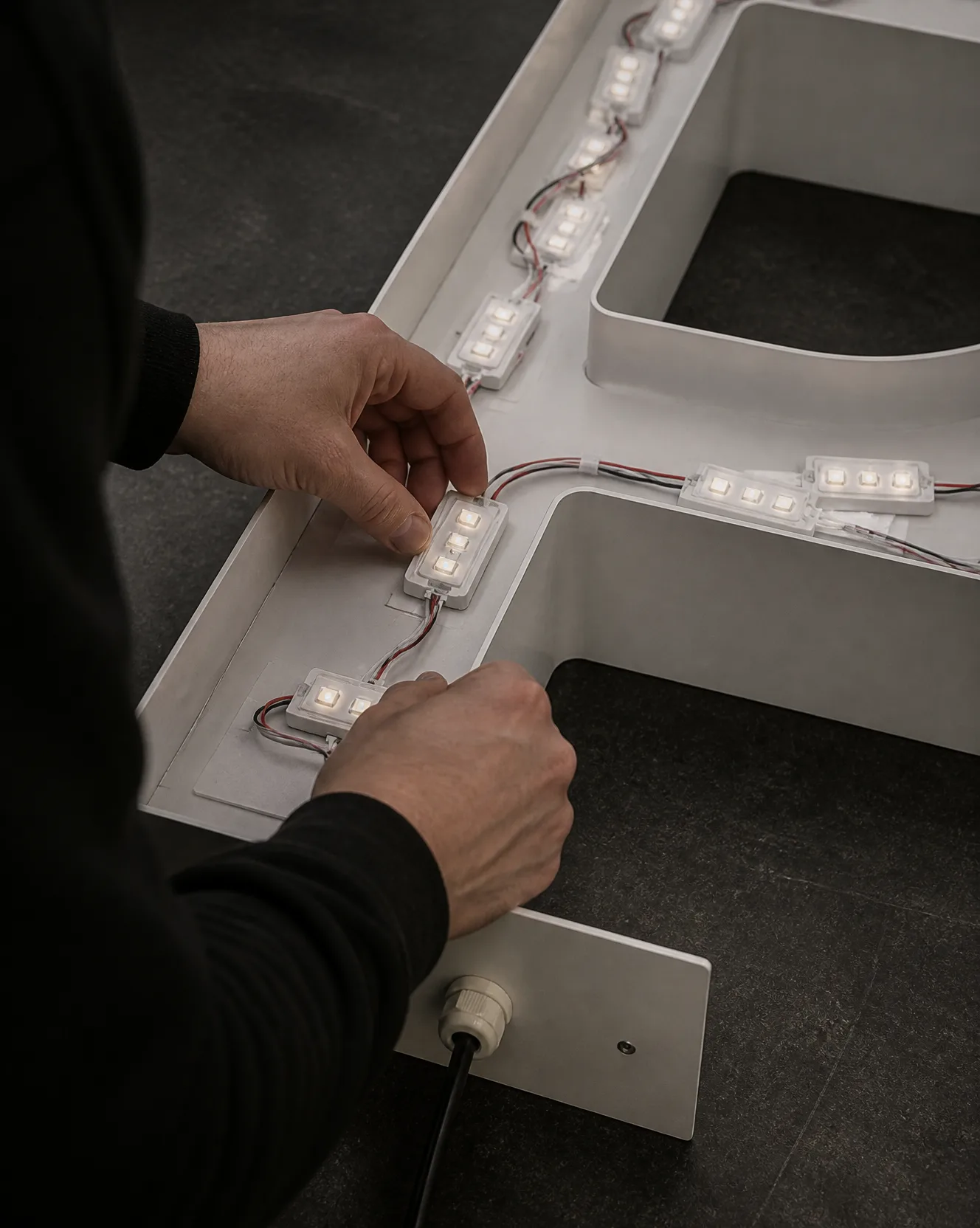 LED modules being set into a fabricated letter